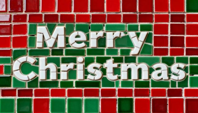 Merry christmas mosaic lettering on green band glazed red and green tiles with grout
