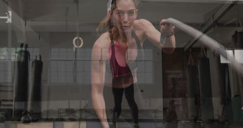 Intense battle rope workout in industrial gym setting