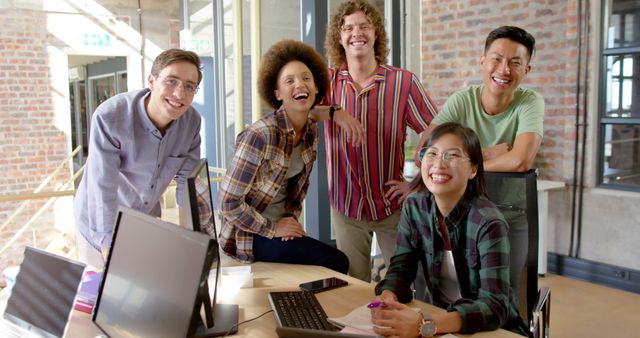 Diverse Team Collaborating and Smiling in Modern Office - Download Free Stock Images Pikwizard.com