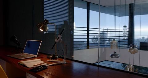 Modern office with wooden desk overlooking waterfront view