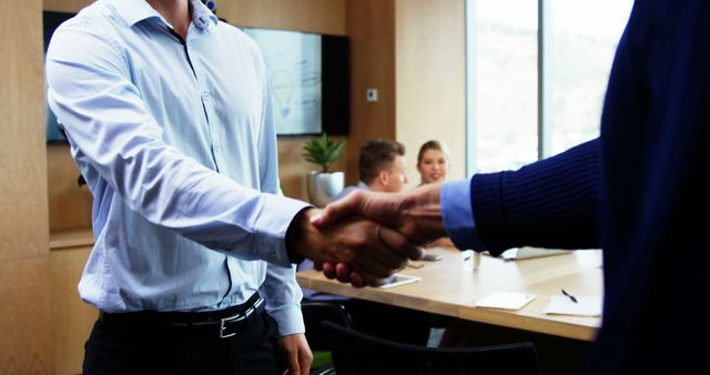 Professional Handshake in Modern Office Meeting - Download Free Stock Images Pikwizard.com