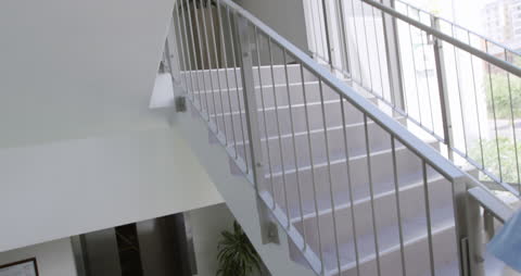 Hijabi Healthcare Worker Swiftly Ascends Hospital Stairs