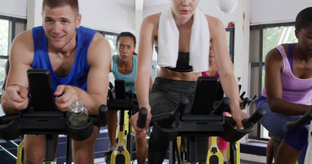 Group of Diverse Individuals in Intense Spin Class Workout - Download Free Stock Images Pikwizard.com