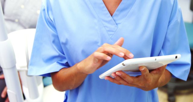 Healthcare Professional Using Digital Tablet in Medical Office - Download Free Stock Images Pikwizard.com