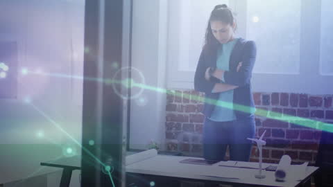 Focused Businesswoman Analyzing Digital Networking Ideas in Office