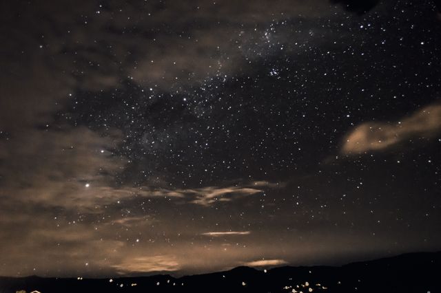 Starry Night Sky with Shimmering Stars and Clouds - Download Free Stock Photos Pikwizard.com