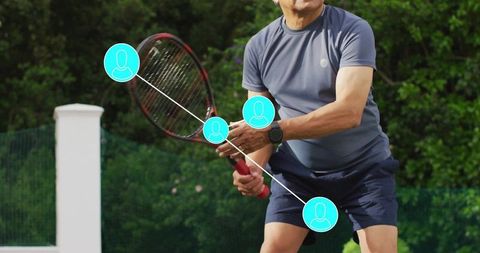 Senior athlete practicing tennis backhand on sunlit court