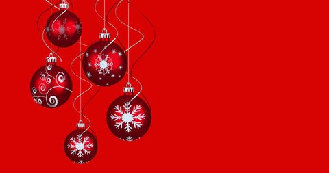 Red Christmas Baubles with Snowflake Design on Bright Background