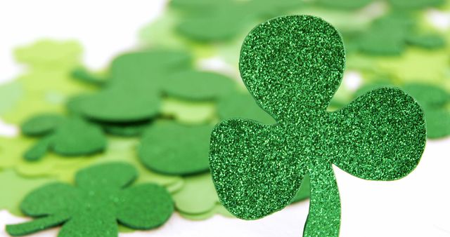 Glittery green shamrock commonly used for St. Patrick's Day celebrations. Ideal for festive decor, greeting cards, and holiday crafts. Represents Irish luck and heritage, enhancing any themed event or digital content.