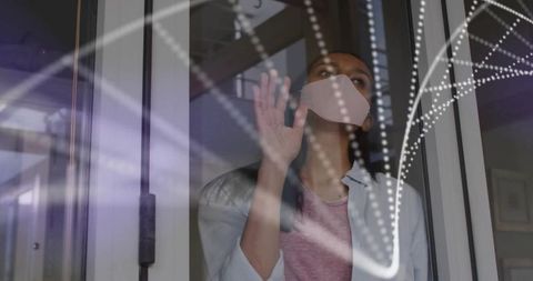 Woman Wearing Face Mask Pressing Hand on Glass Door Looking Through Reflections and Light