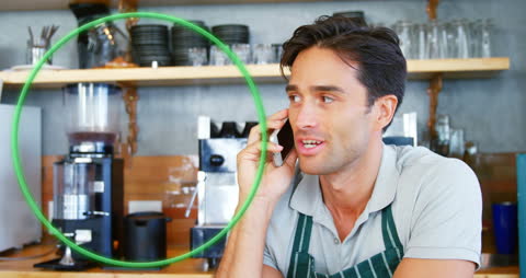 Barista at Coffee Shop Taking Phone Call