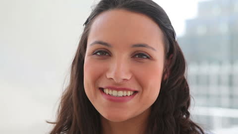 Confident Woman Smiling During Business Conversation