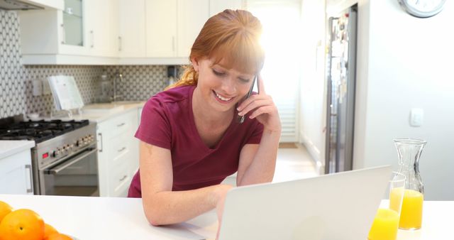 Smiling Woman Working from Home, Talking on Phone in Kitchen - Download Free Stock Images Pikwizard.com