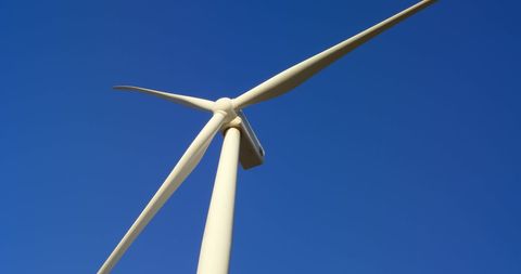 Low Angle View of Wind Turbine Against Clear Blue Sky - Download Free Stock Images Pikwizard.com