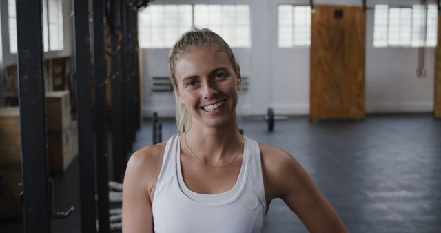 Smiling Woman in Fitness Clothing in Gym - Download Free Stock Images Pikwizard.com