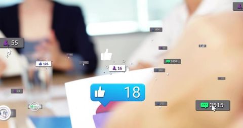 Business team reviewing tablet and documents with floating social media engagement overlay