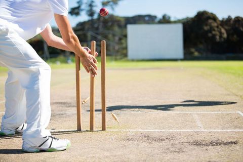 Cricketer wicket keeping catch challenge in action