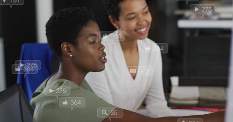 Women Collaborating in Office with Social Media Overlay