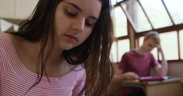 Female Student Studying in Classroom Wearing Striped Shirt - Download Free Stock Images Pikwizard.com