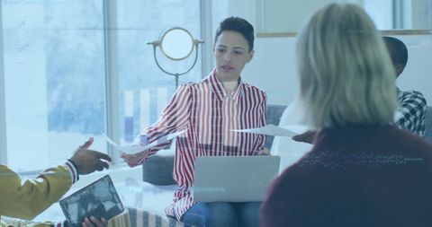 Collaborative Financial Data Analysis Meeting in Modern Office