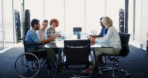 Diverse Collaborative Team Meeting in Modern Office