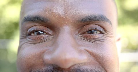 Close-Up of Elderly Man's Eyes and Smile Conveying Joy