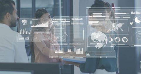 Collaborative team reviewing digital dashboards with augmented hud in modern office