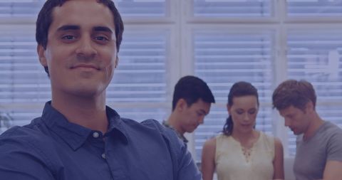 Confident Professional with Team Collaborating in Background - Download Free Stock Images Pikwizard.com