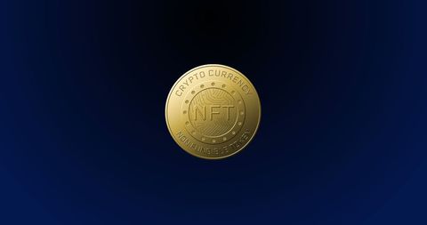 Golden nft coin spinning on blue background for cryptocurrency