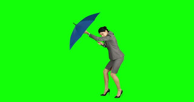 Woman Battling Wind with Umbrella on Green Screen - Download Free Stock Images Pikwizard.com