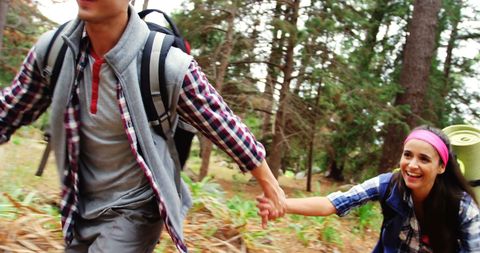 Couple Hiking in Forest Holding Hands Embracing Adventure - Download Free Stock Images Pikwizard.com