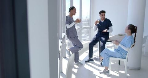 Medical Professionals Relaxing in a Modern Hospital Break Room