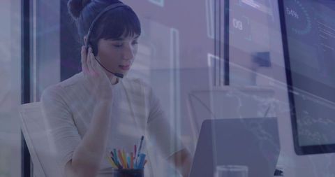 Professional Focused on Technology and Data with Headset and Laptop