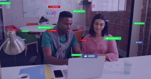 Diverse colleagues interacting with social media data in modern office
