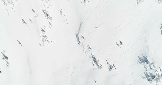 Aerial View of Pristine Snow-Covered Mountain Landscape with Ski Tracks - Download Free Stock Photos Pikwizard.com