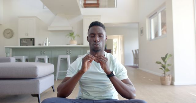 Man Meditating in Modern Living Room for Mental Wellness - Download Free Stock Images Pikwizard.com