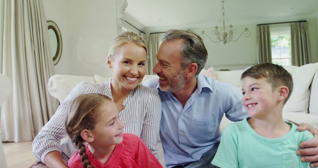 Happy Family Smiling Together in Living Room - Download Free Stock Images Pikwizard.com