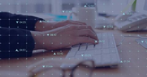 Typing hands with digital grid overlay on workspace for productivity and visualization