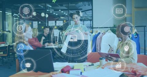 Fashion Designers Collaborating in Modern Open-Plan Studio