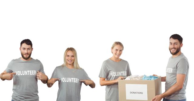 Image depicts a couple wearing gray volunteer shirts smiling and preparing a box labeled 'Donations' together. Useful for illustrating themes of charity, community service, teamwork, giving back, and volunteer activities. Suitable for campaigns, articles, and websites promoting philanthropy and volunteer opportunities.