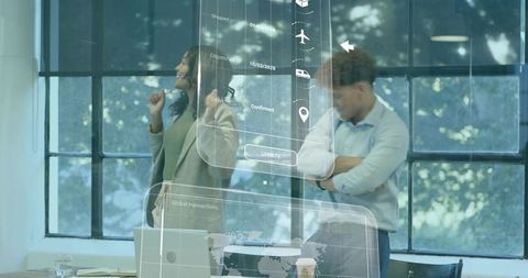 Business team collaborating with holographic logistics interface in modern office workspace