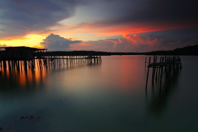 Wooden Boardwalk on Body of Water during Dawn - Download Free Stock Photos Pikwizard.com