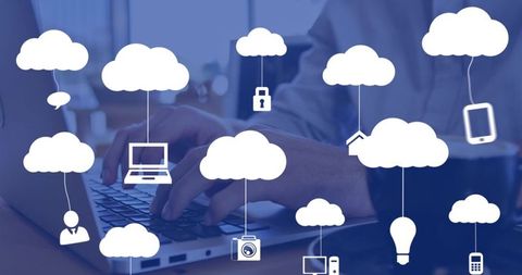 Hands typing on laptop with cloud computing icons overlay