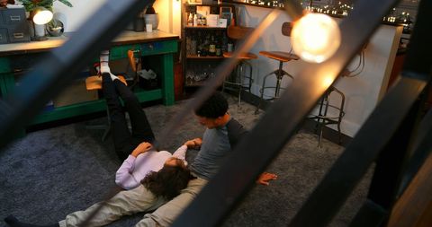 Relaxed couple enjoying tablet in cozy home interior