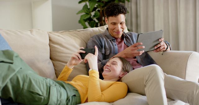 Happy Couple Using Tablet and Smartphone at Home - Download Free Stock Images Pikwizard.com
