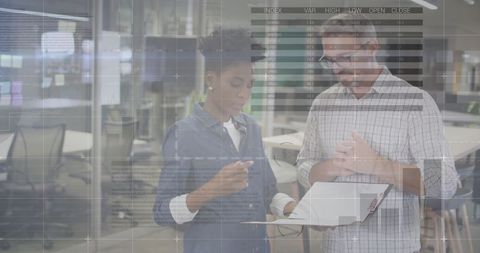 Multicultural Professionals Collaborating on Data Analysis in Modern Office - Download Free Stock Images Pikwizard.com