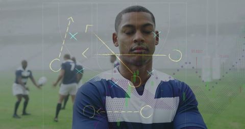 Rugby player focused on strategy chart interface