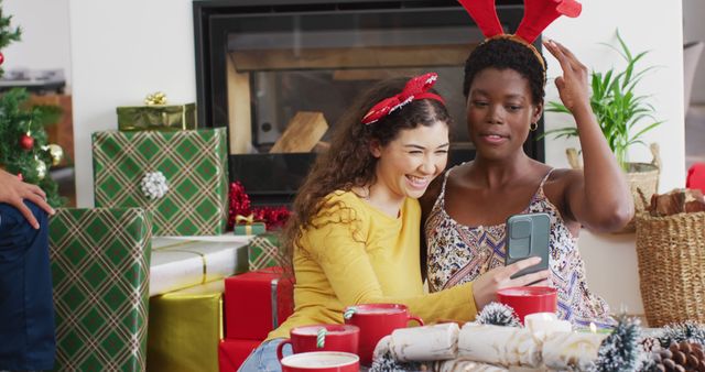 Multiracial friends taking holiday selfie near Christmas presents - Download Free Stock Images Pikwizard.com