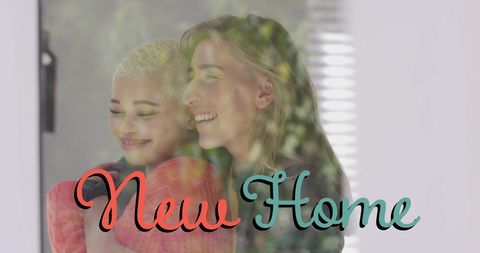 Diverse Female Couple Celebrating New Home Together