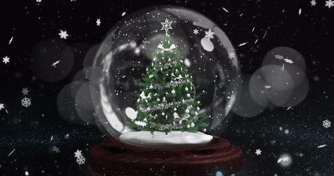 Christmas Tree Snow Globe Illuminated by Falling Snowflakes
